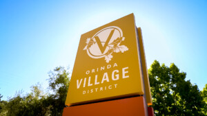 yellow sign saying Orinda Village District