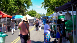 People walking on the street at the outdoor market