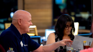 A man and woman ordering food at a restaurant