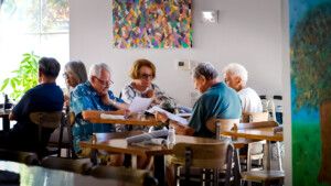 Friends sitting at a restaurant looking at menues