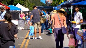 People walking on the street at the outdoor market