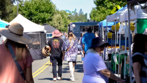 People walking on the street at the outdoor market