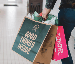 Shopping bag with text 'Good Things Inside' on side of bag